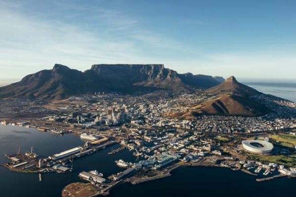 Aerial coastal view of cape town city with table mountain, cape town harbour, lions head and devils peak, South africa.